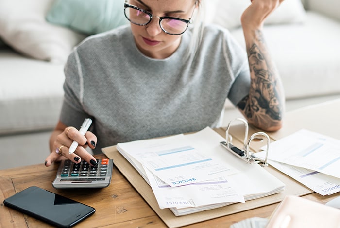 woman calculating sales tax